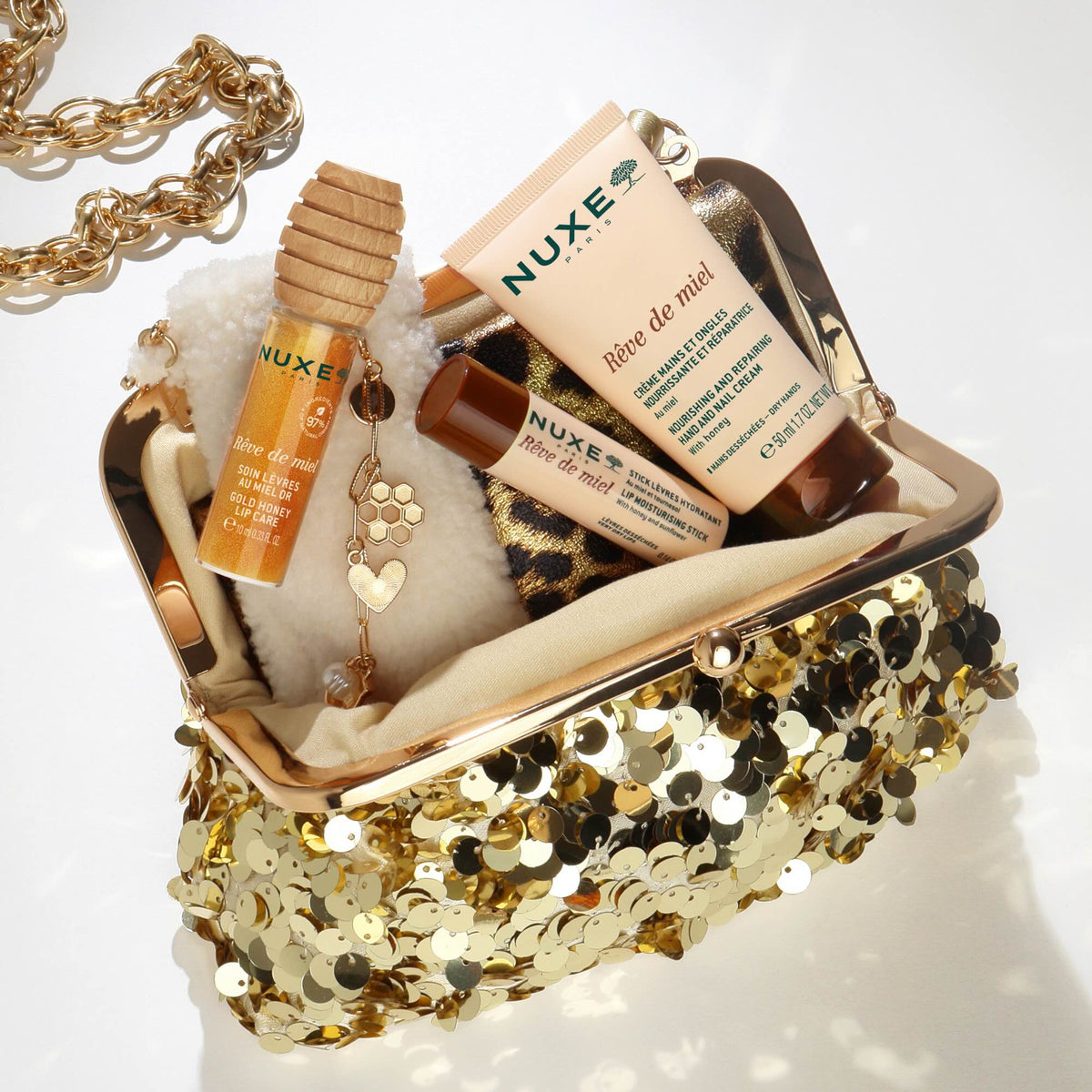 NUXE Rêve de Miel Gold-Lippenöl im Etui mit Charms (1 Stk)